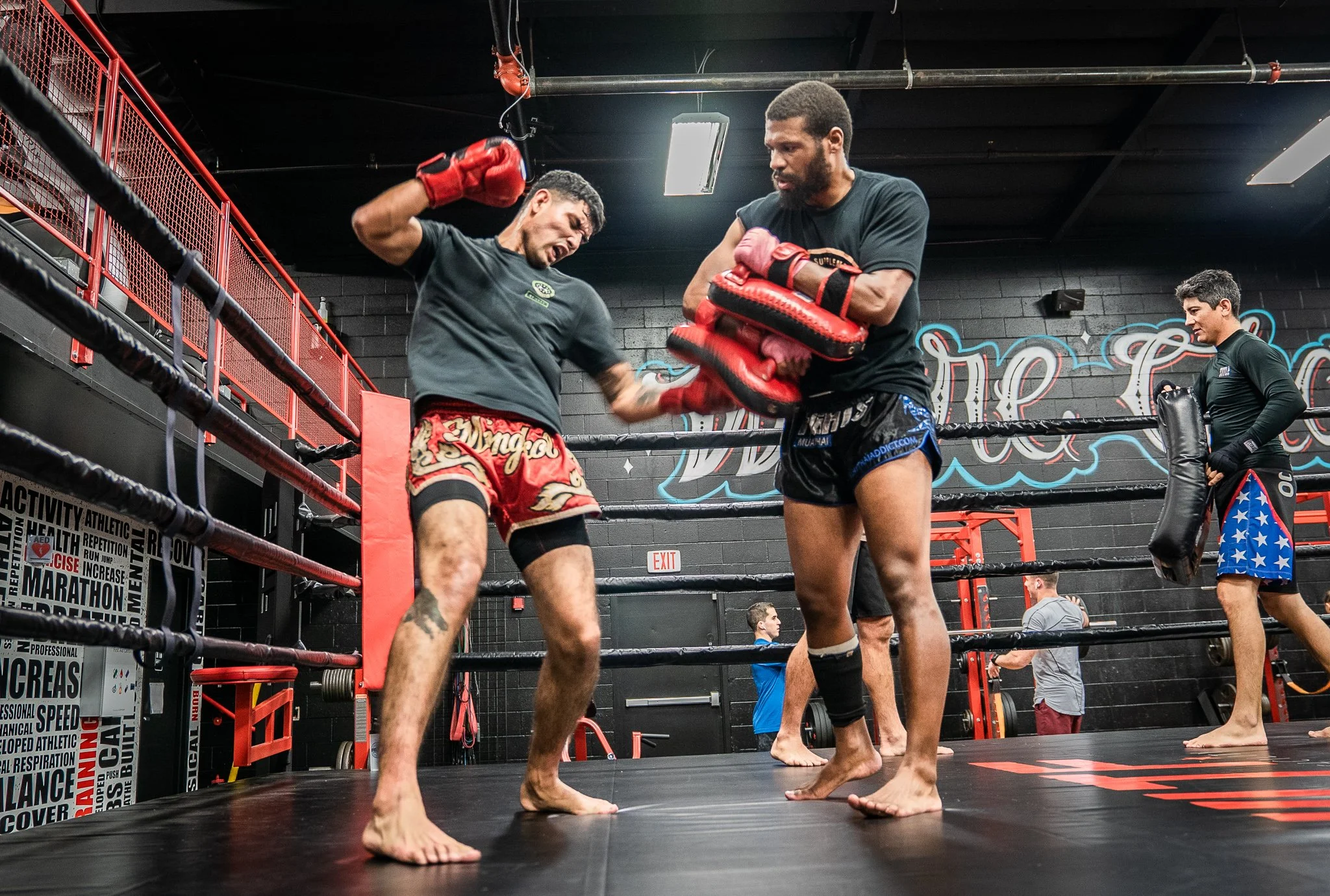 Muay Thai fighter hitting pads