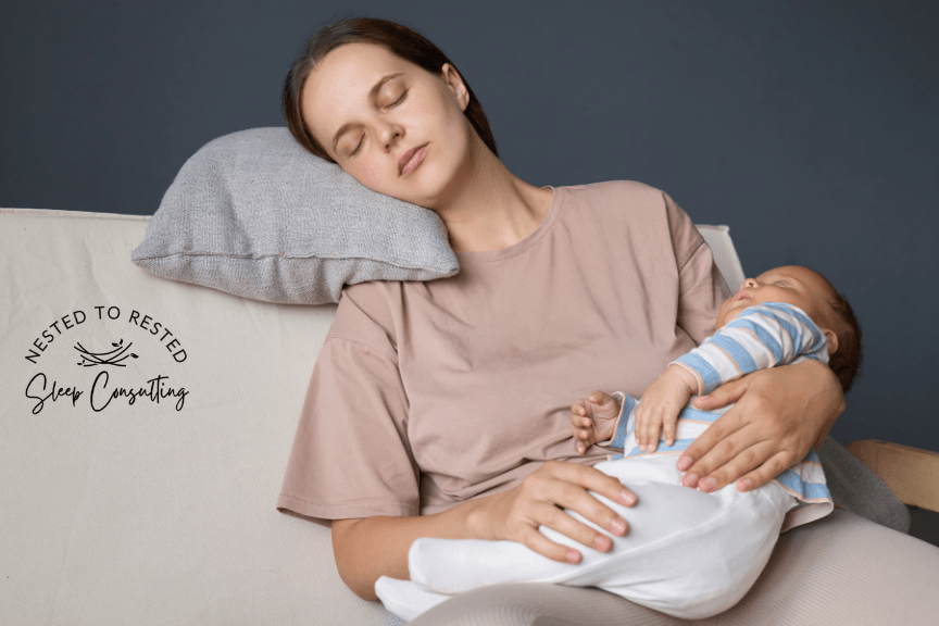 Tired mom holding sleeping newborn baby at night