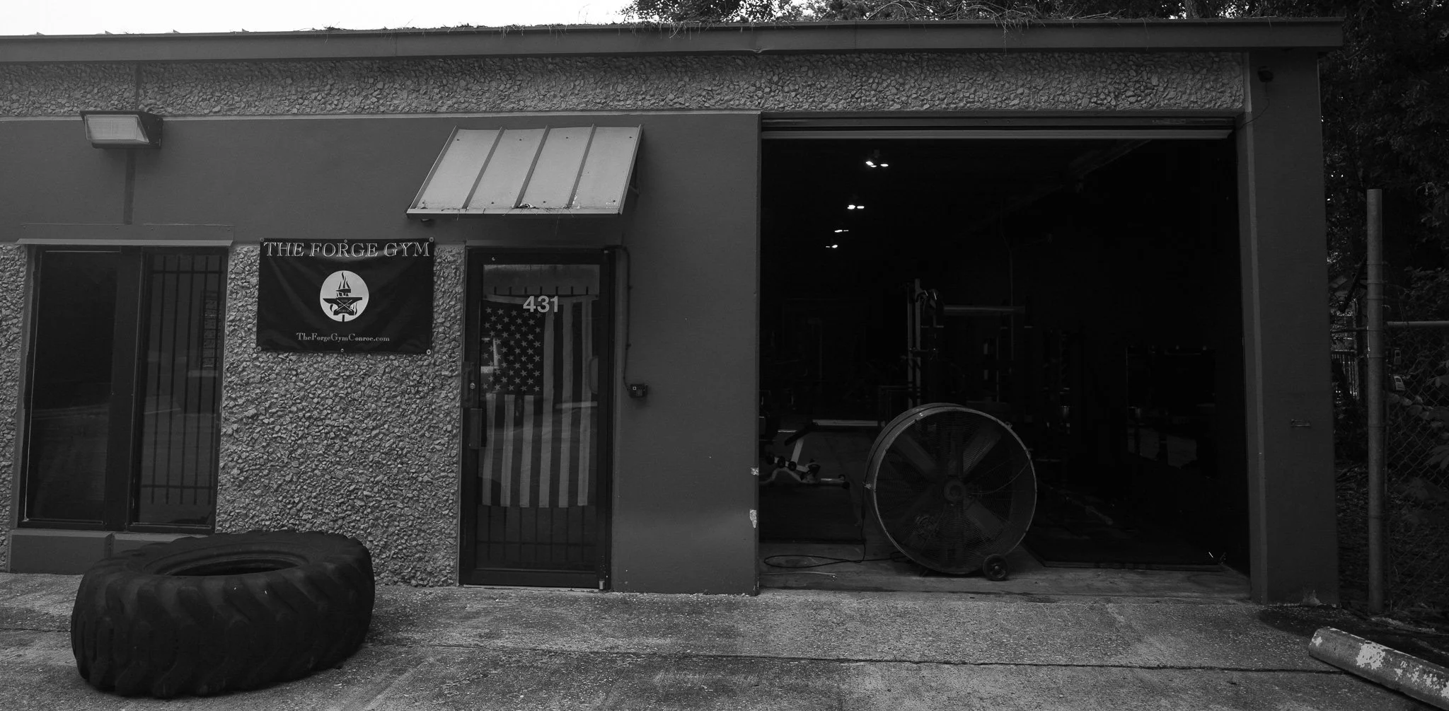 Exterior entrance to The Forge Gym from Enterprise Row in Conroe, Texas