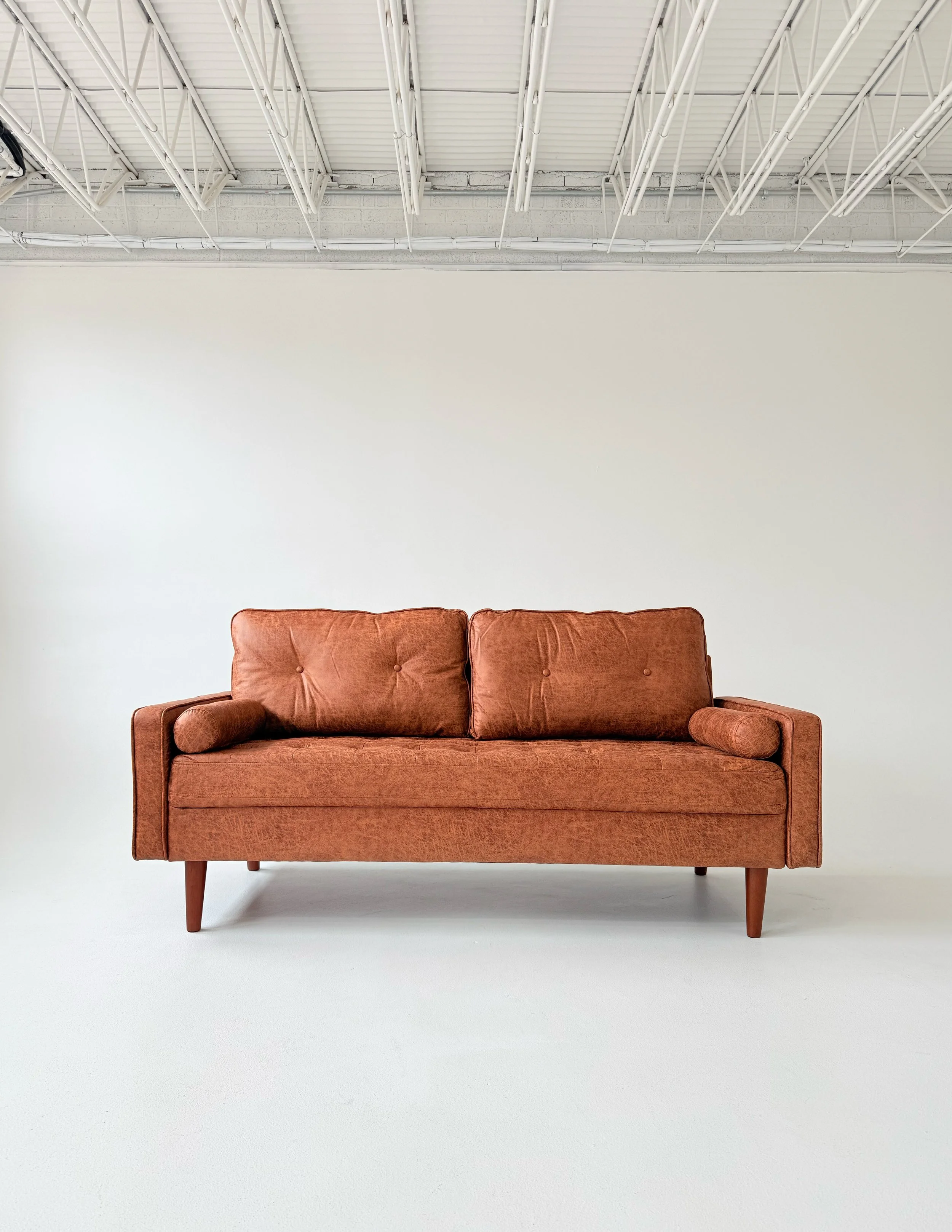 Faux leather loveseat at Sixteenth St. Studio in Greeley, Colorado