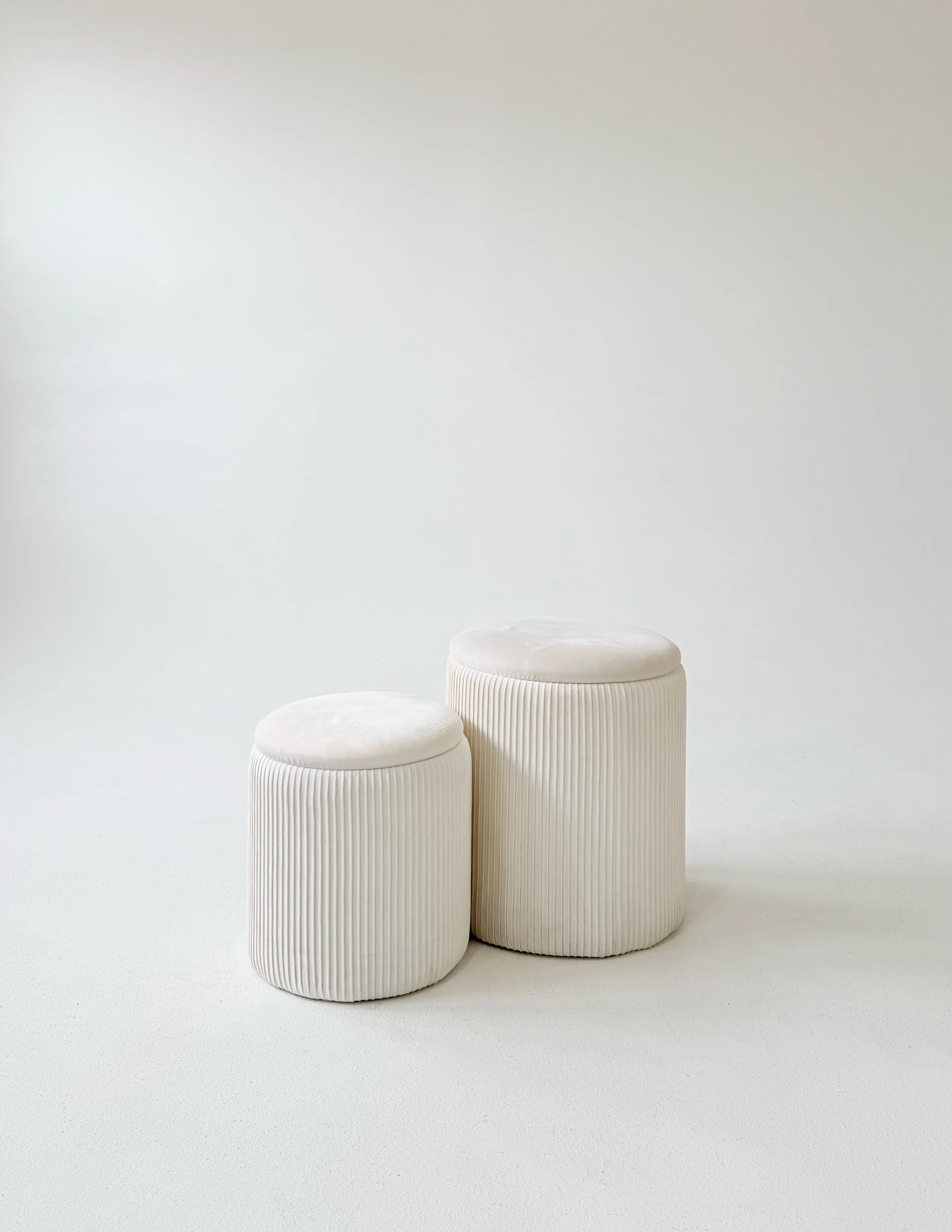 Nesting white velvet stools at Sixteenth St. Studio in Greeley, Colorado
