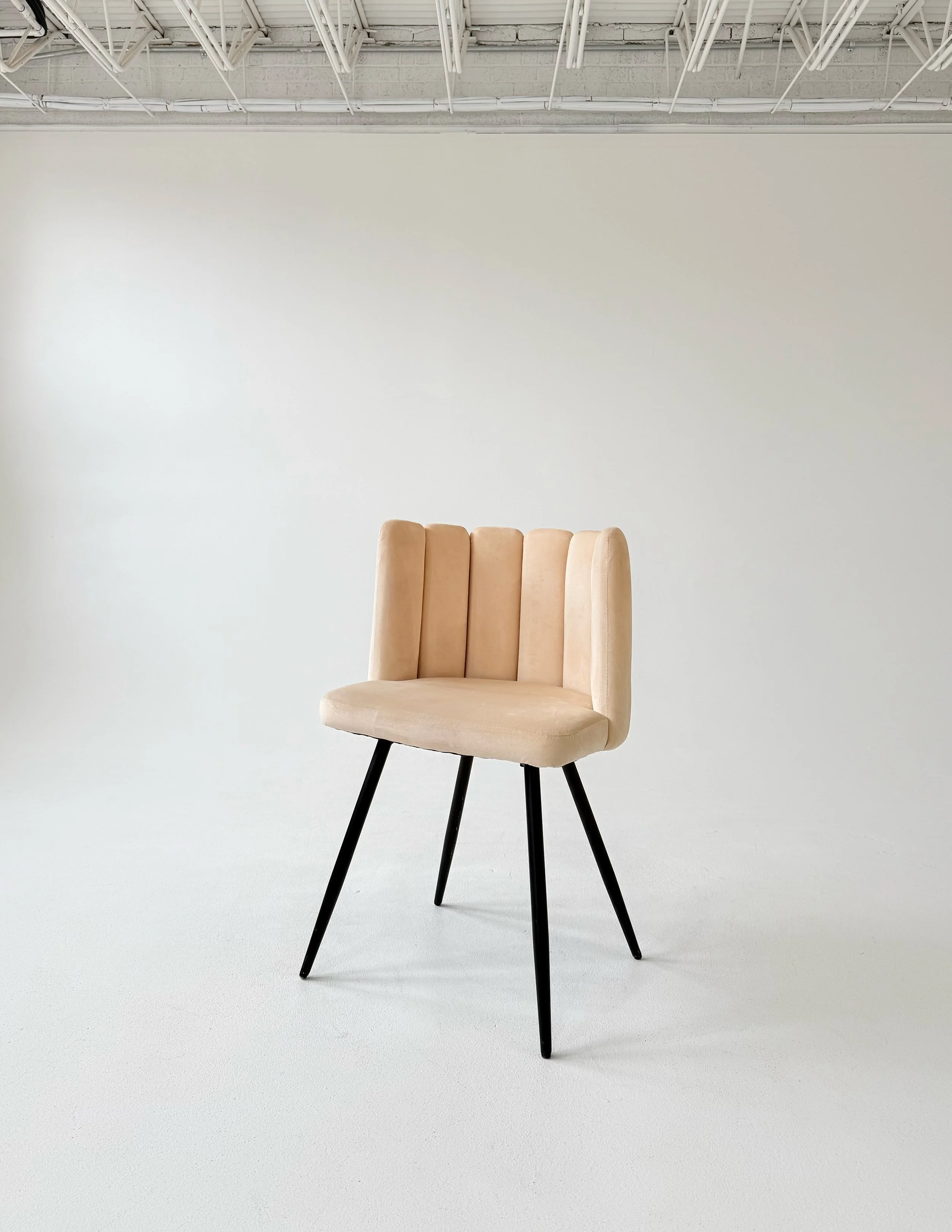 Cream velvet chair at Sixteenth St. Studio in Greeley, Colorado