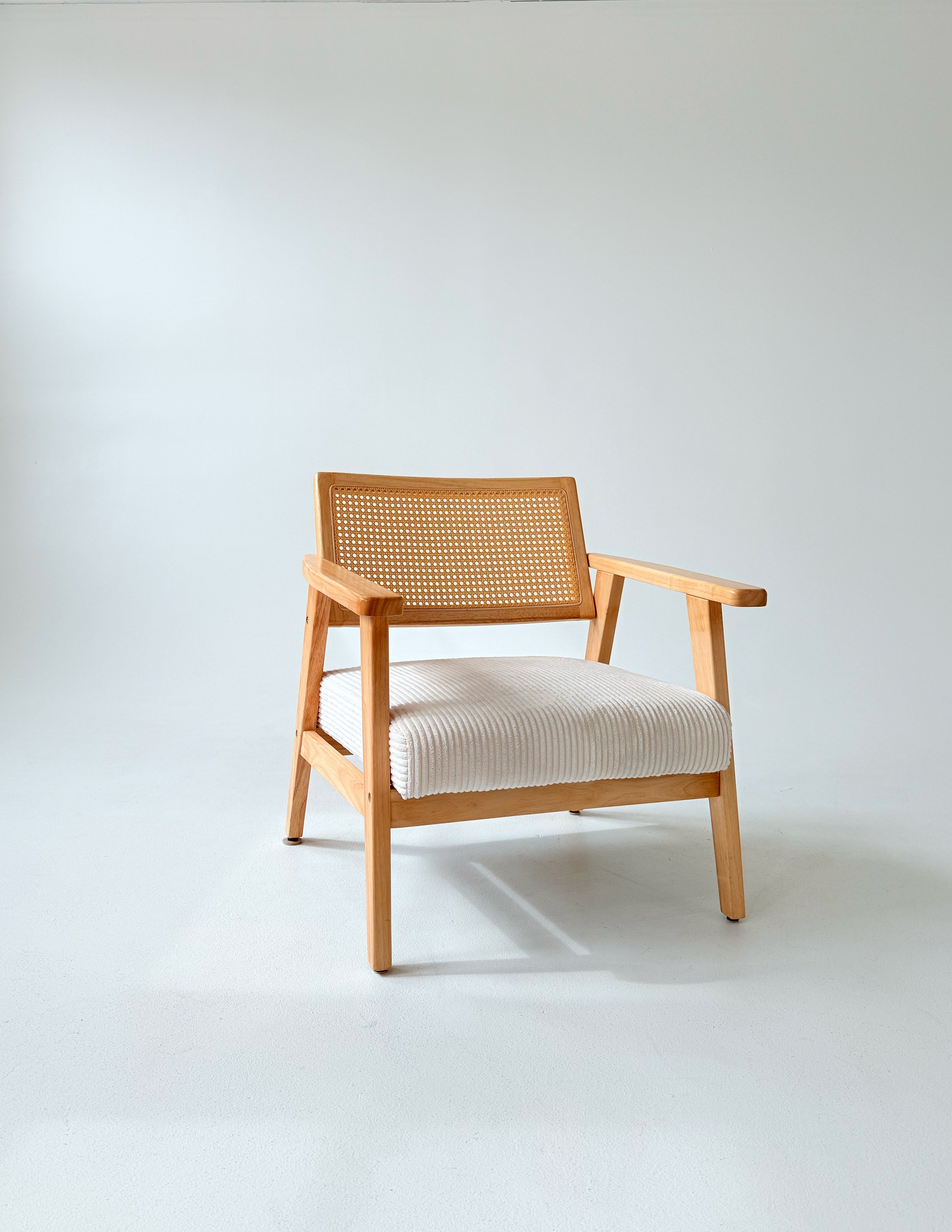 Rattan white chair at Sixteenth St. Studio in Greeley, Colorado