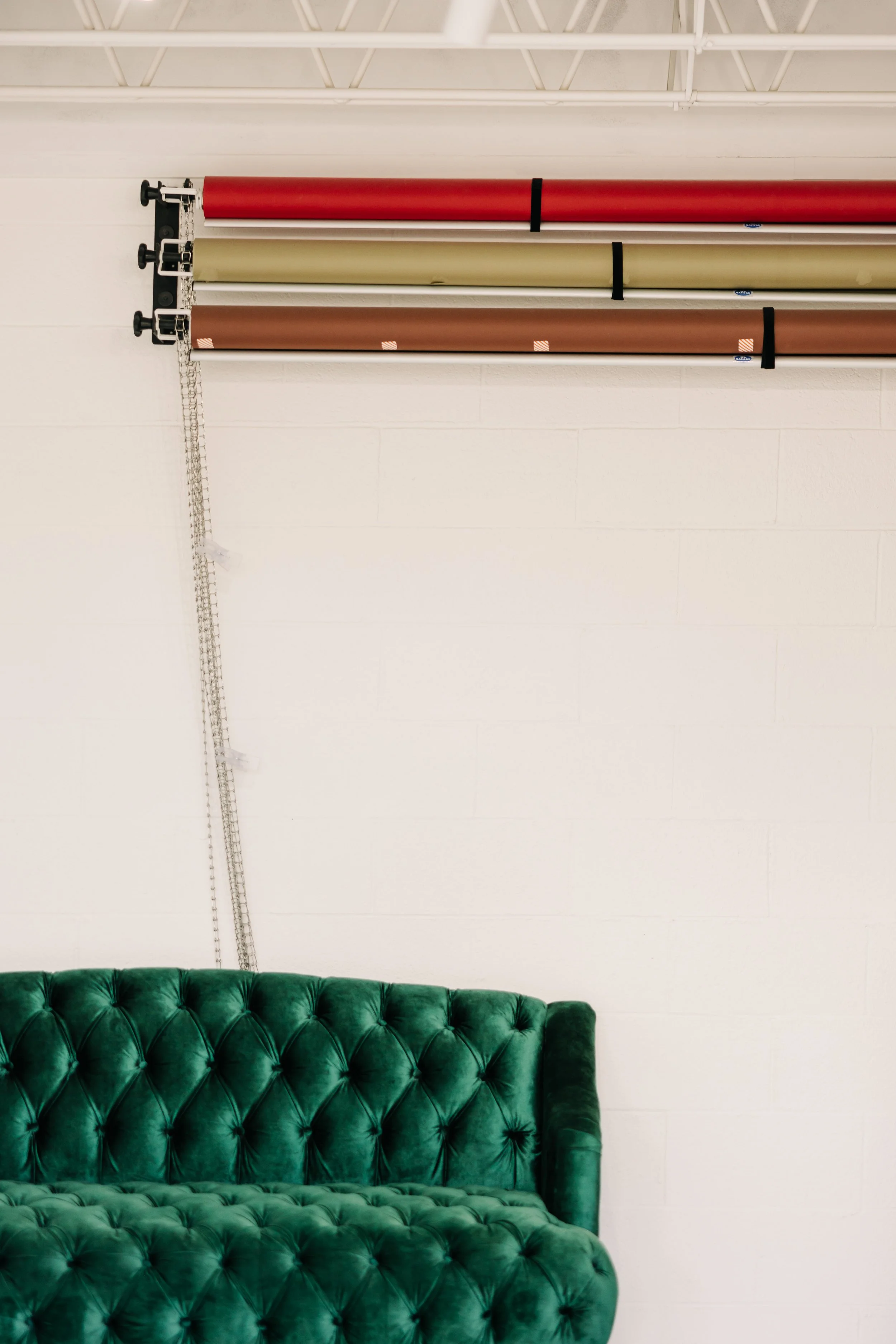 Image of photo backdrop system at Greeley Photo Studio, Sixteenth St. Studio with green couch