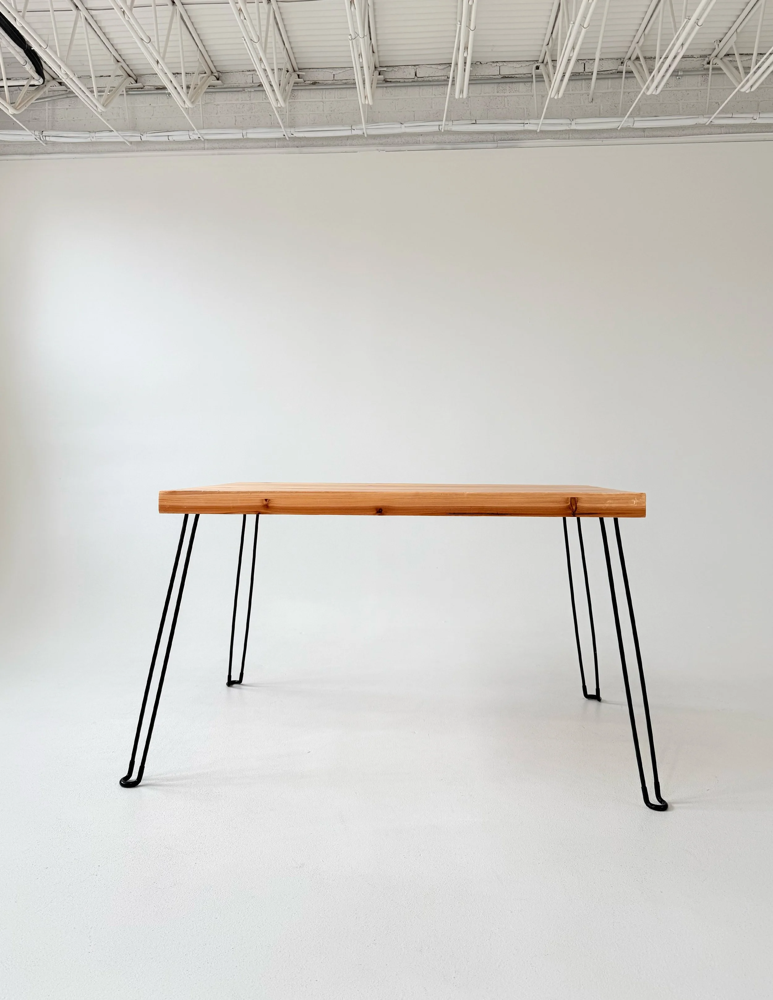 Pine desk with black pin legs at Sixteenth St. Studio in Greeley, Colorado