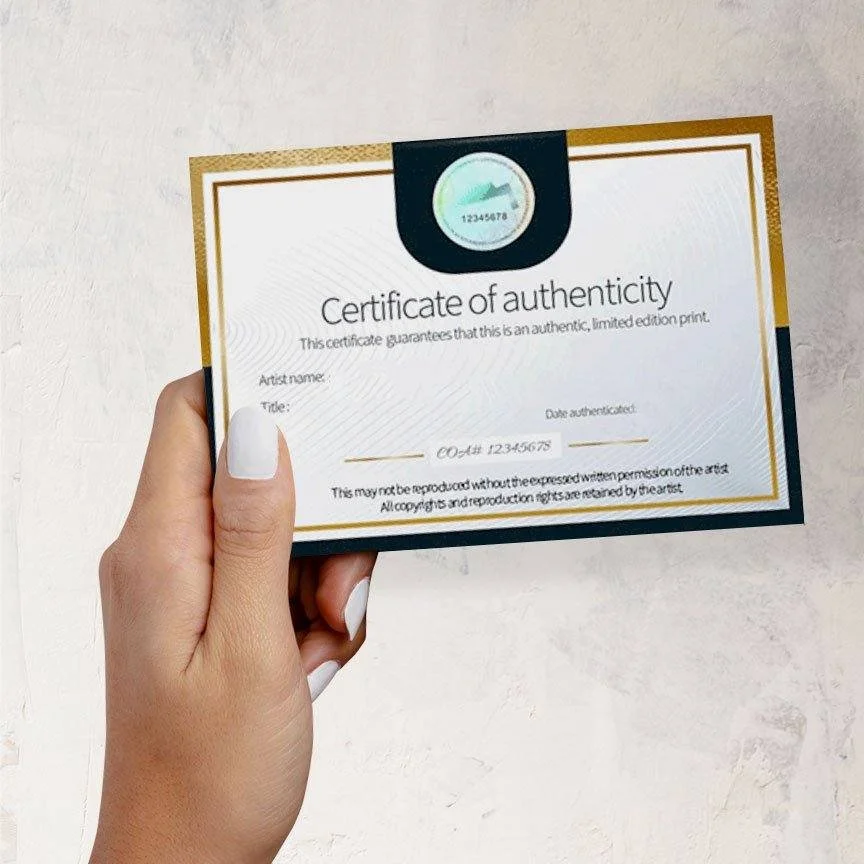 Portrait Collection Series certificate of authenticity card held in a hand