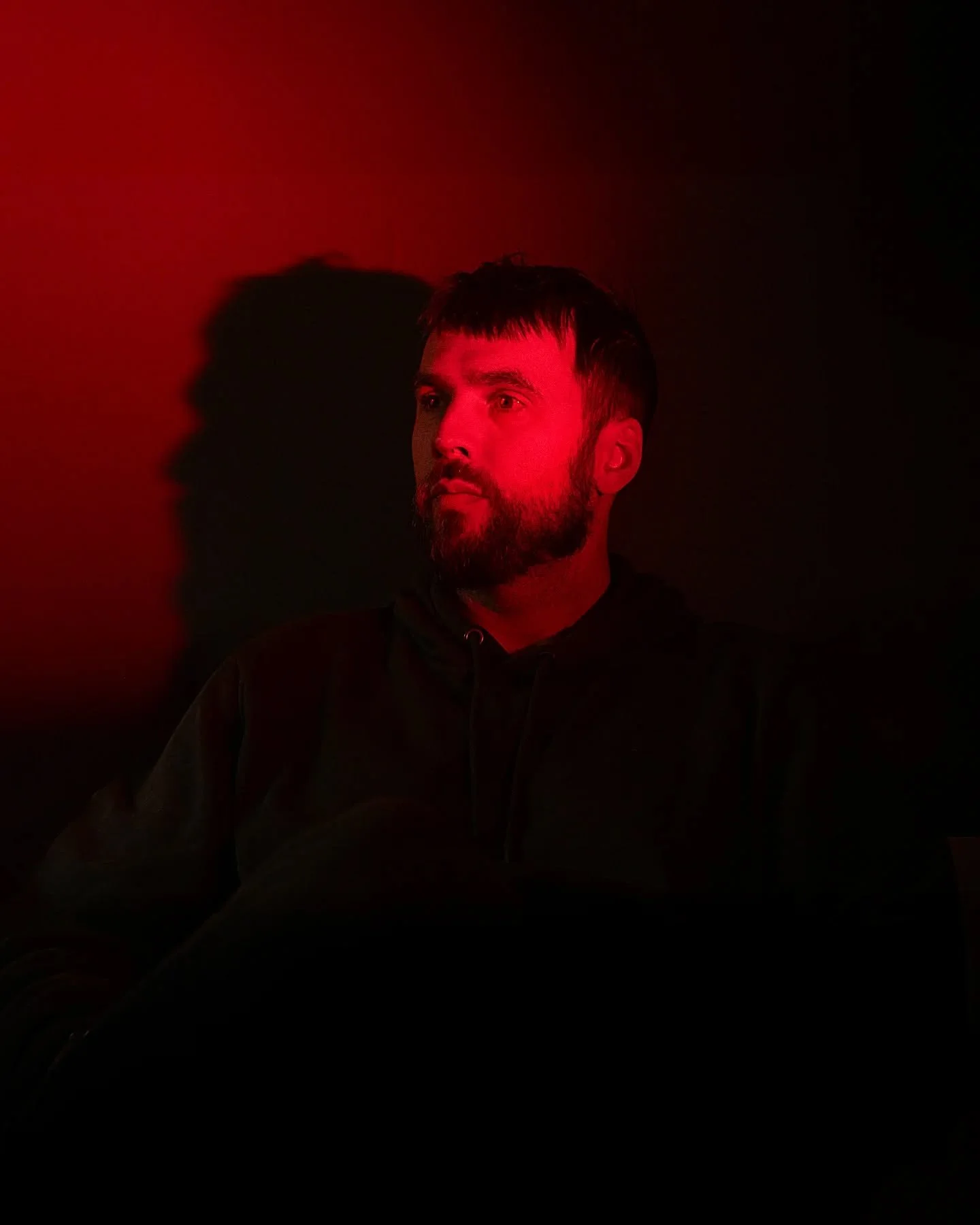 Off-camera flash with a red gel... cool shadow effect.

&quot;I'm just trying to watch TV&quot; - Matt, 2025

#gelphotography #gelphoto #portrait #redphotography #spookyphotography #godoxad200 #canon