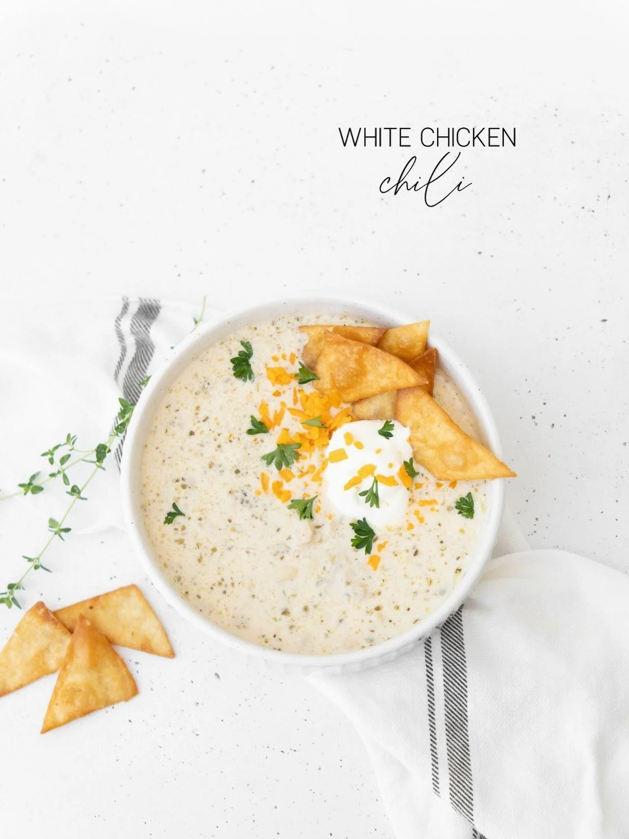 White Chicken Chili Soup is simmering today!

A cozy, flavorful bowl filled with tender chicken and white beans simmered in a creamy broth with green chilis and warm spices. Finished with a topping of melty cheese, sour cream, and crunchy tortilla ch