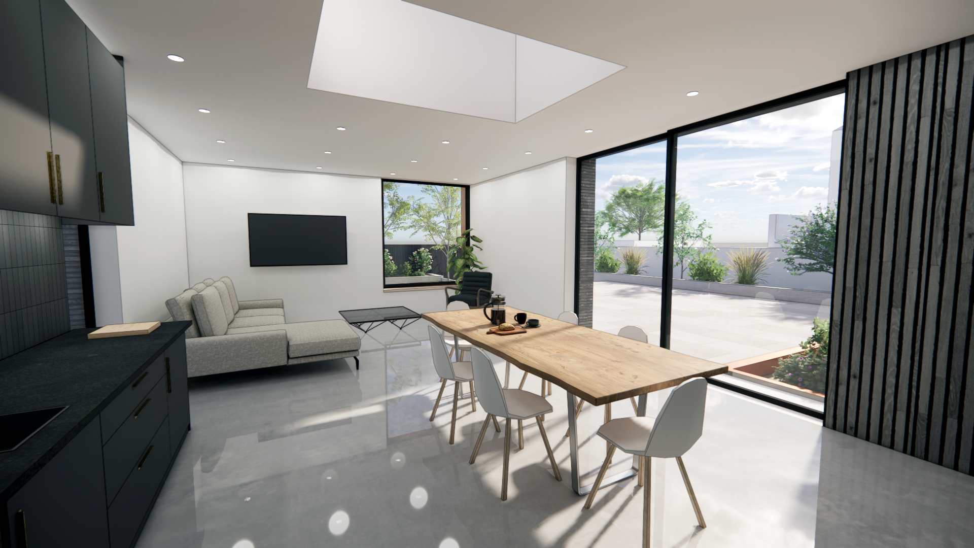 interior view of kitchen, with black kitchen on left, table in centre foregound and seating area. large feature windows, sliding doors and rooflight