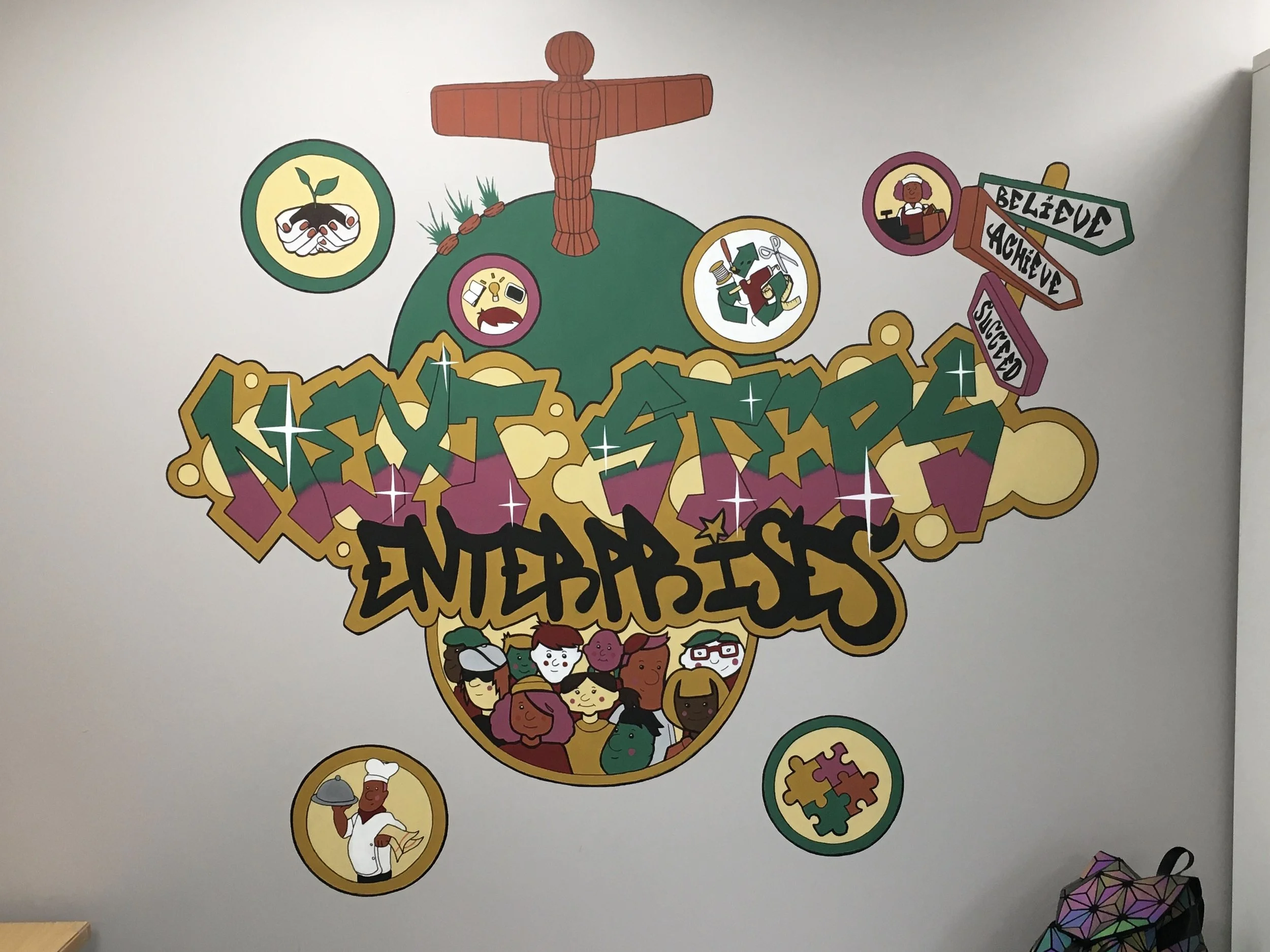 Colorful wall mural with graffiti-style text reading 'Skate Shares Entrepreneurship,' surrounded by illustrations of diverse people, a globe, signs with words 'Believe,' 'Achieve,' 'Succeed,' and various icons including a puzzle piece and a chef.