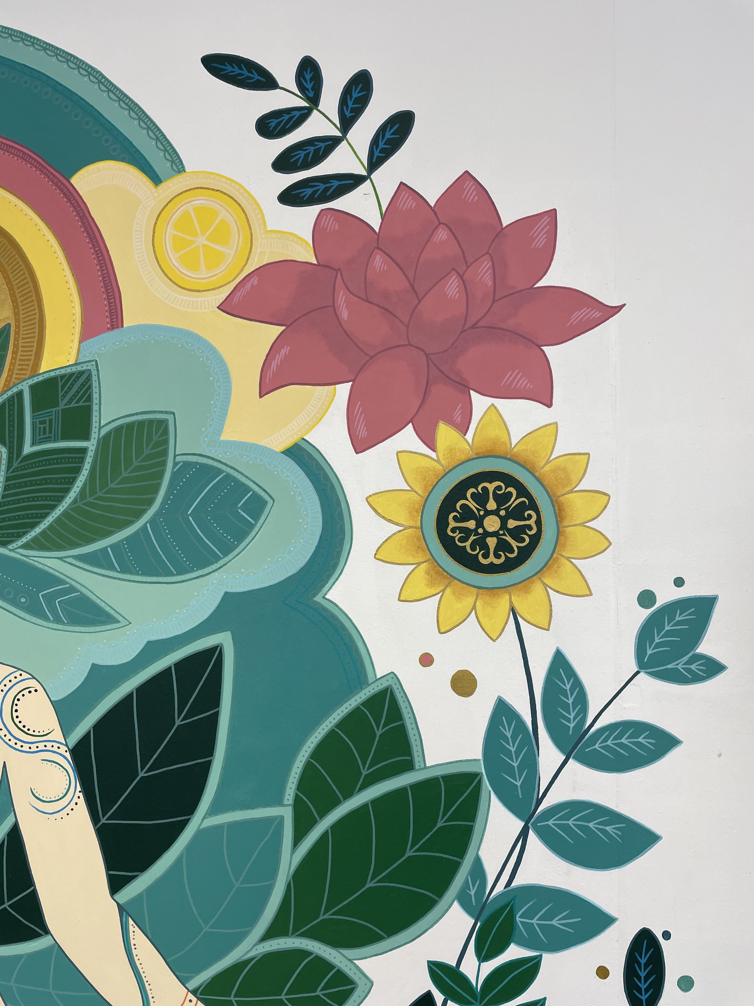 Colorful floral illustration with large pink, yellow, and turquoise flowers, green leaves, and abstract design elements on a white background.