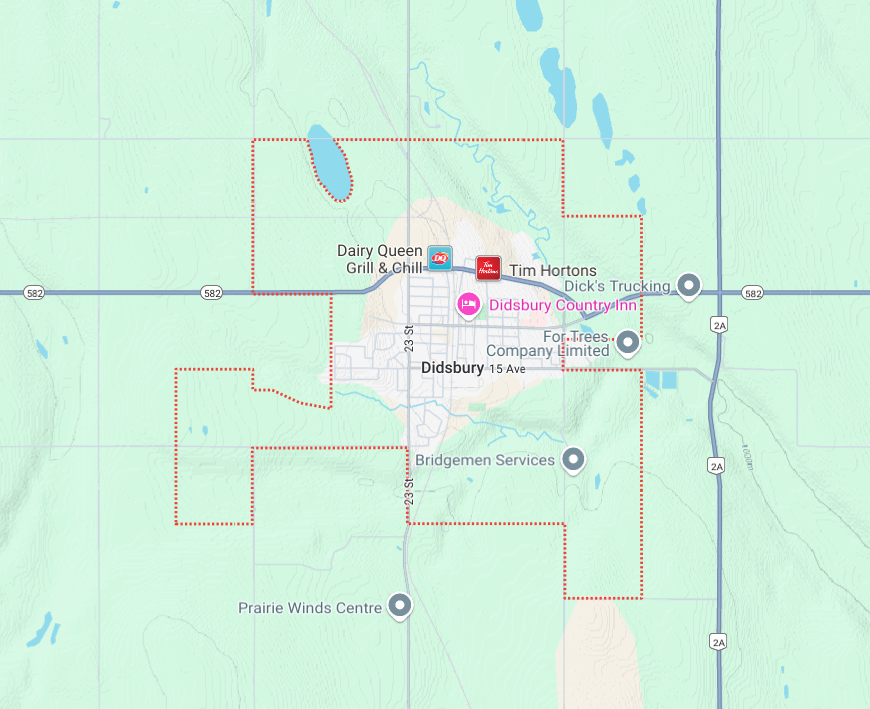 Map showing the town of Didsbury, with locations of businesses and services, including Dairy Queen, Tim Hortons, Didsbury Country Inn, and Bridgeman Services.