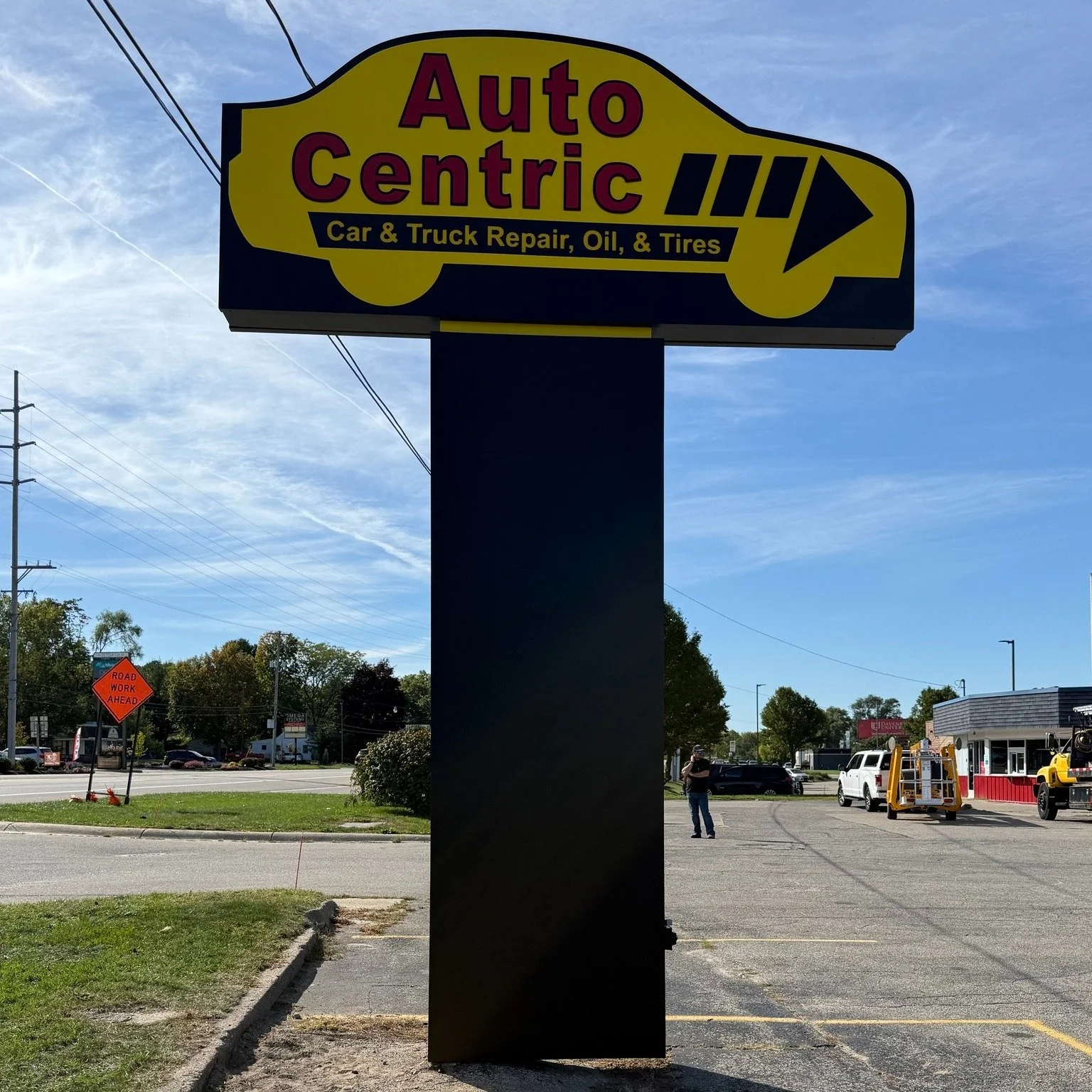 Check out this one of a kind illuminated pylon sign for Auto Centric in Grand Rapids! 

This one features a SignComp double face standard body aluminum sign cabinet on the lower portion and a custom fabricated car shaped cabinet on the upper portion.