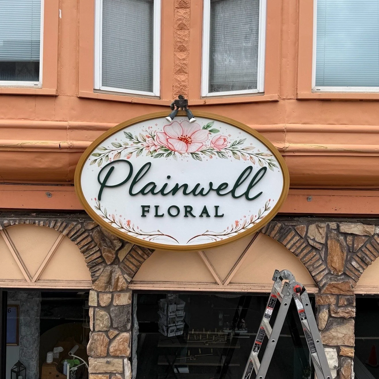 Another fun project for Plainwell Floral! This externally lit wall sign replaced the existing, but with some nice added features:

▫️ Routed aluminum composite panel. 
▫️ Digitally printed, custom floral graphics. 
▫️ Custom metallic gold, and green 