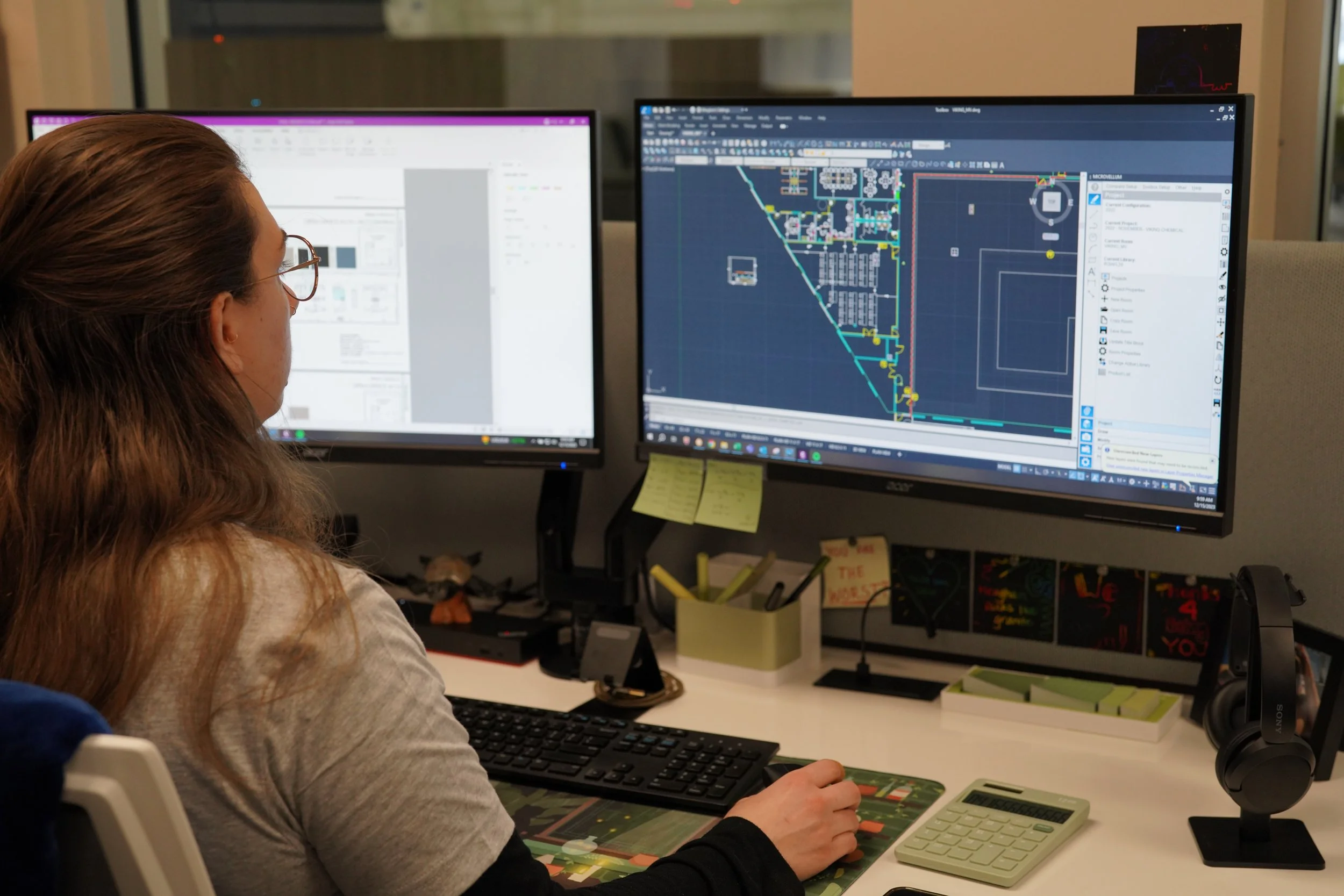 Designer at computer working on office layout
