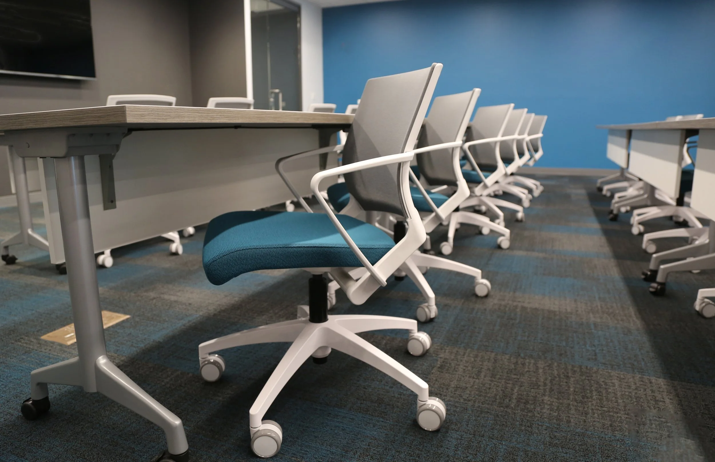 low shot of conference chairs with blue seats