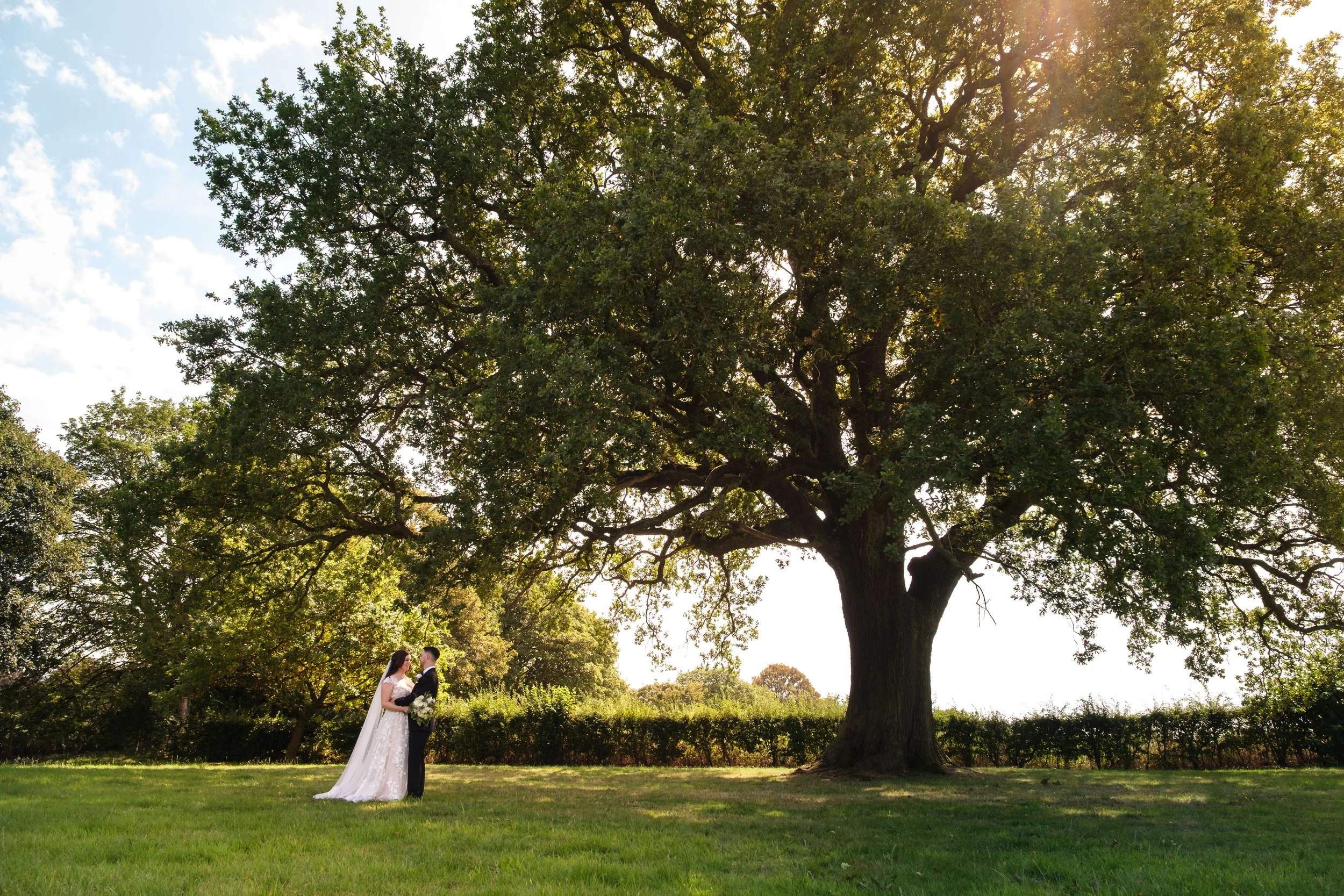 Wedding at the Plough Inn, Eaton. Wedding portrait in front of the ancient oak