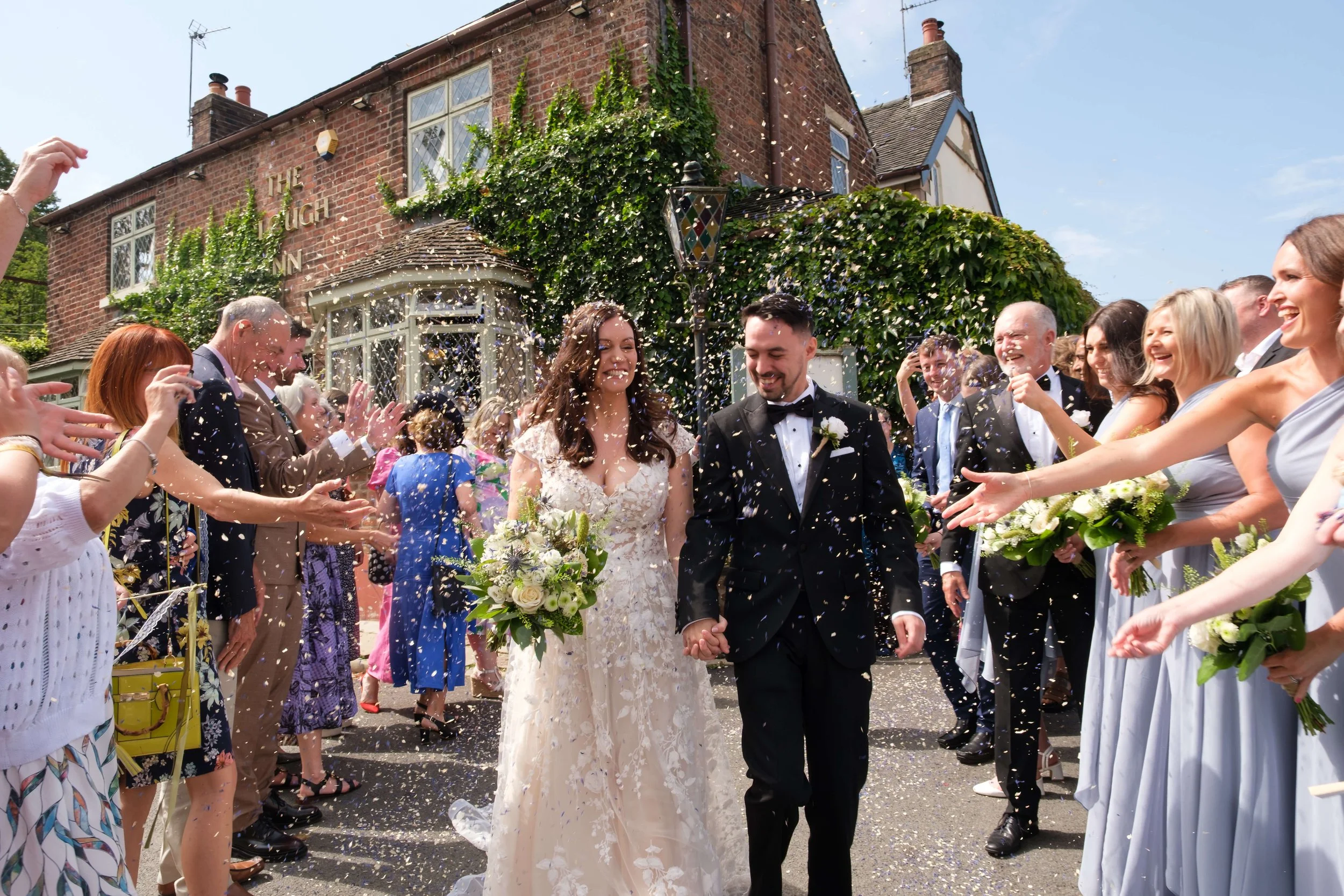 Wedding at the Plough Inn, Eaton. Bride and Groom being showered in confetti