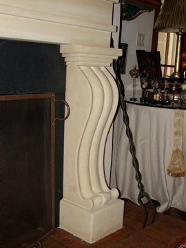 Antiqued Texas limestone fireplace for a private residence in Santa Fe.