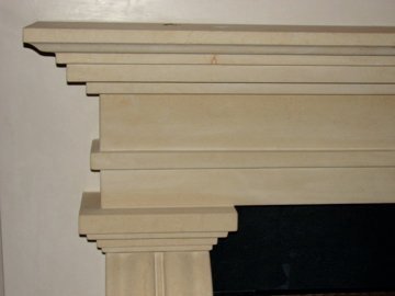 Detail of antiqued Texas limestone fireplace for a private residence in Santa Fe.