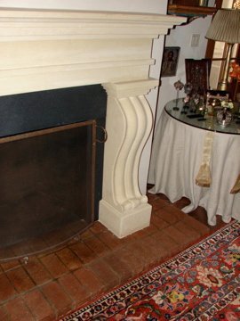 Antiqued Texas limestone fireplace for a private residence in Santa Fe.