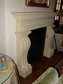 Antiqued Texas limestone fireplace for a private residence in Santa Fe.