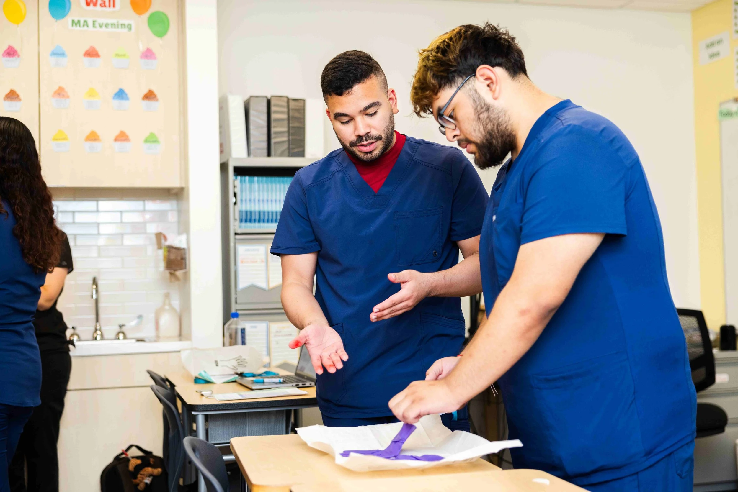 Students in the Medical Assistant Program collaborate on a class project.