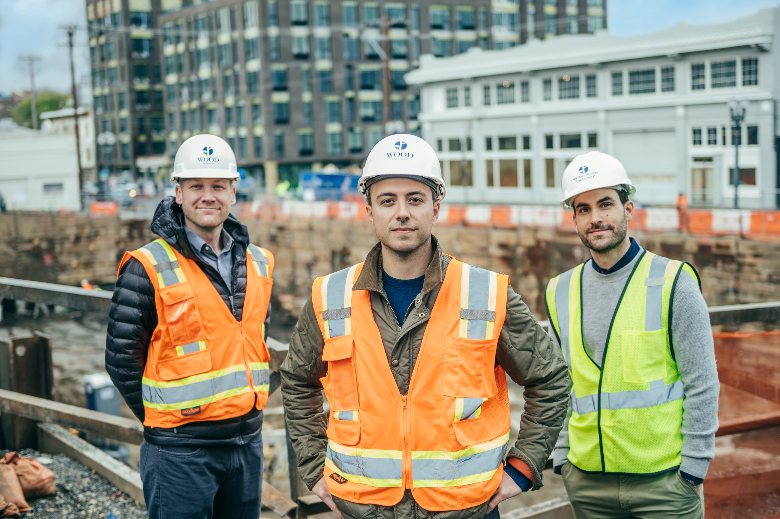 The professionals in property development standing together, ready to work on a construction site.