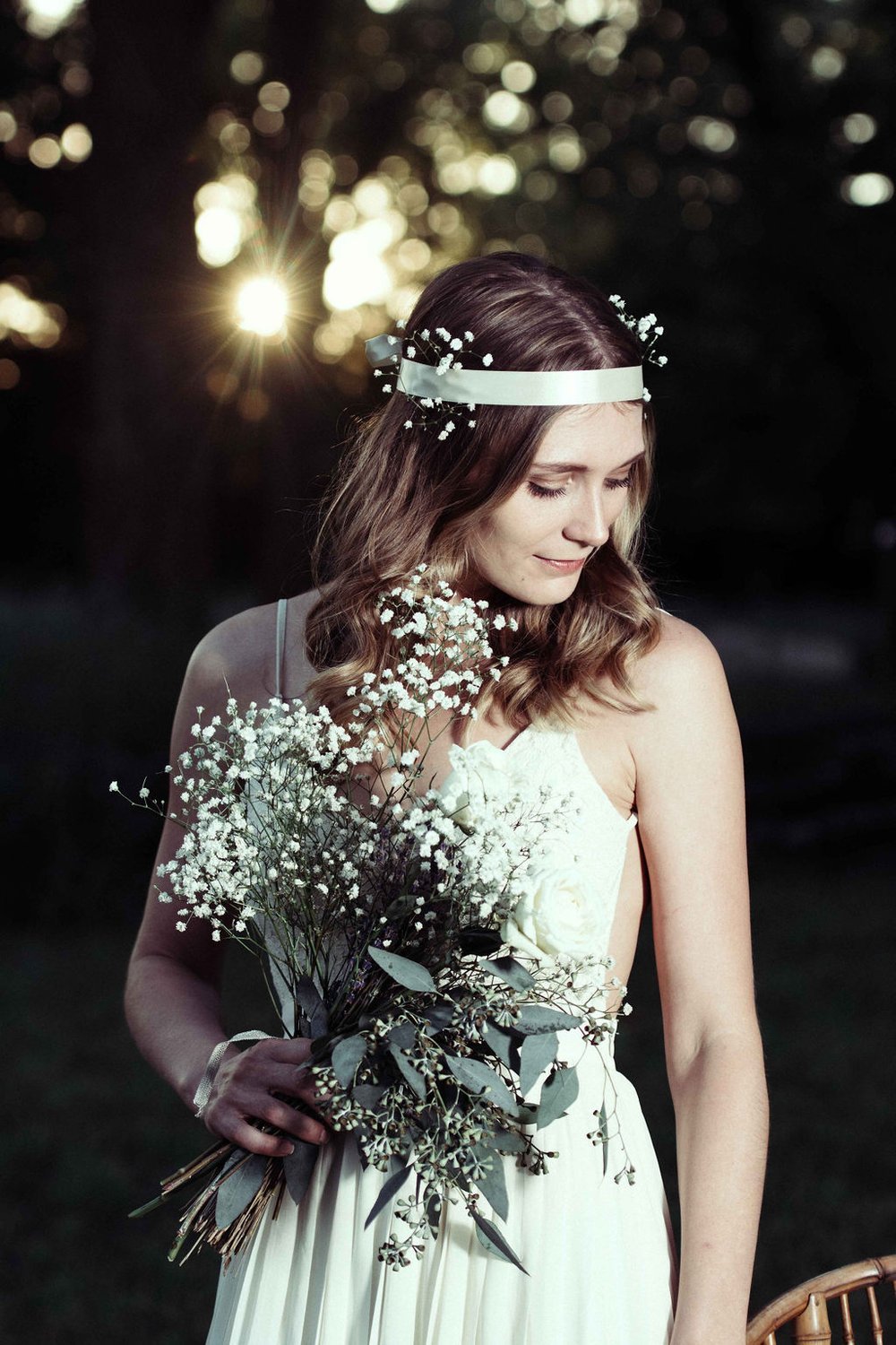Stunning bride in white dress with bouquet. Captured by a personal event photographer.jpg