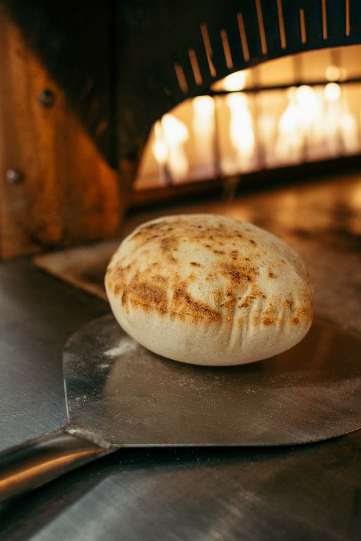 An appetizing bread being prepared in a wood-burning oven, photographed by Portland's finest food photographer.jpg