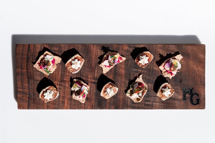Expertly captured by a dessert photographer, a wooden cutting board displays an assortment of.jpg
