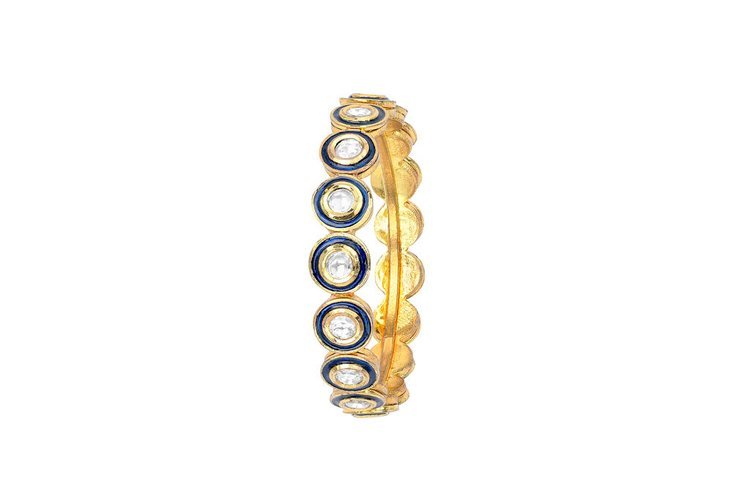 A captivating gold and blue bracelet captured in professional product photography in Portland.jpg