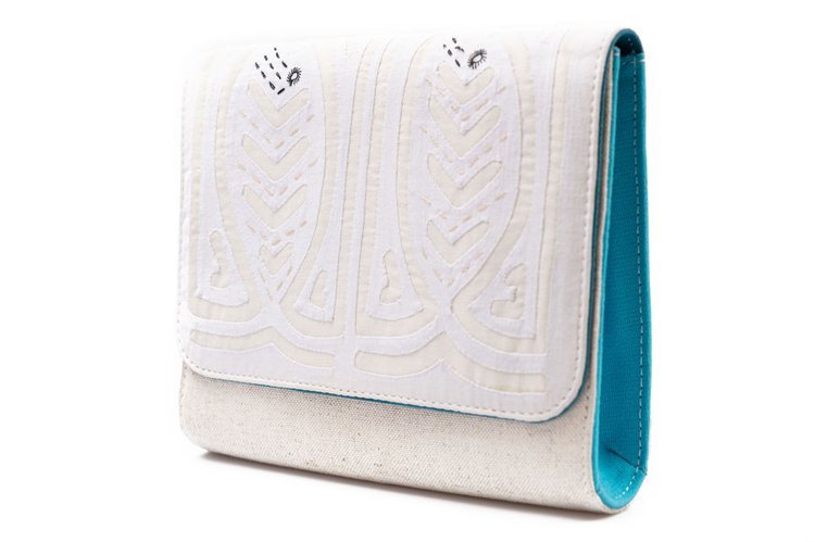 A chic clutch bag in white and turquoise, featuring a beautiful white and blue pattern.jpg