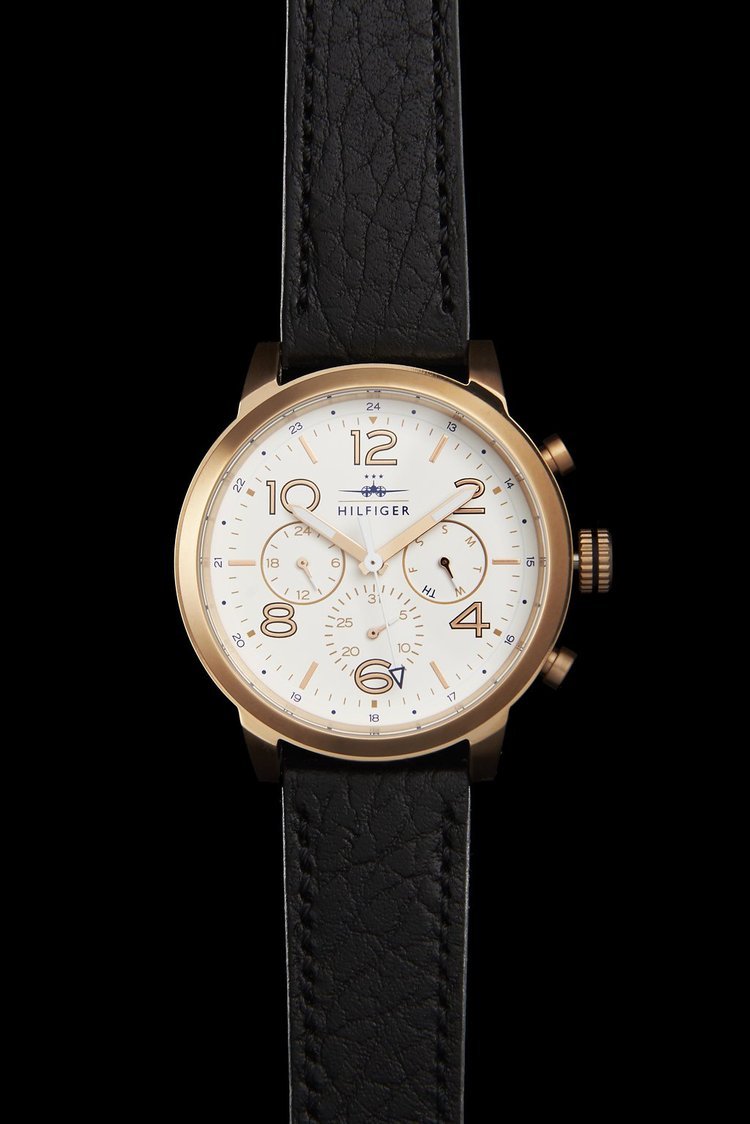 An exquisite timepiece featuring a gold and black design with white dials, crafted for the discerning individual.jpg