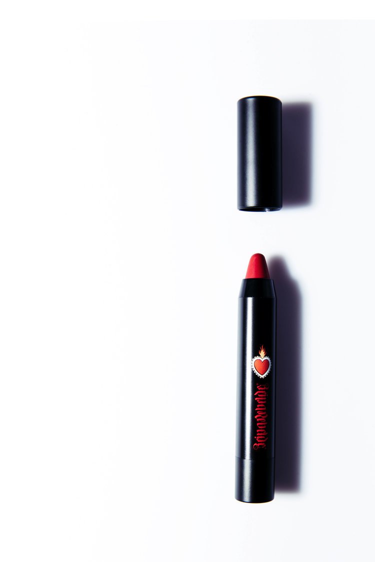Cosmetic product photography A close-up shot of a vibrant lipstick on a white background, showcasing its color and texture.jpg