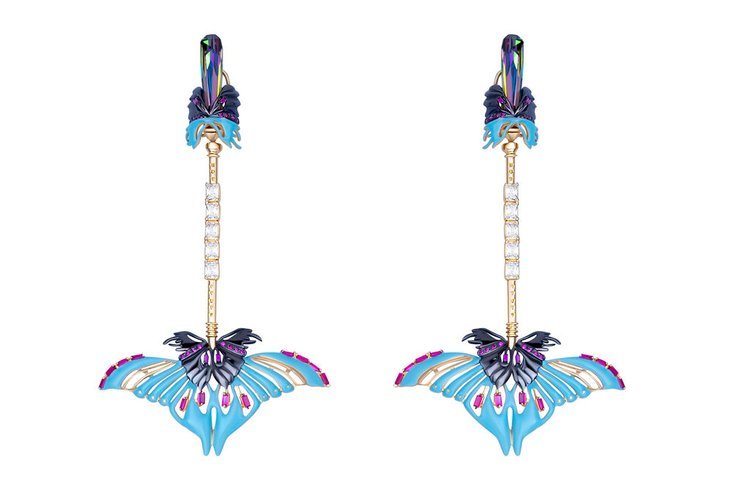 Earrings adorned with vibrant blue and purple flowers, captured beautifully by a skilled jewelry photographer.jpg