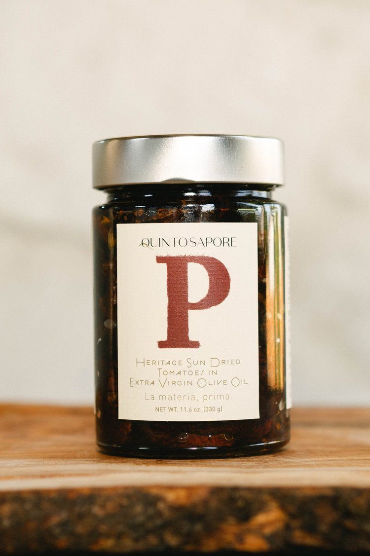 The image, taken by a product photographer in Portland, showcases an olive oil jar bearing the letter P denoting brand.jpg