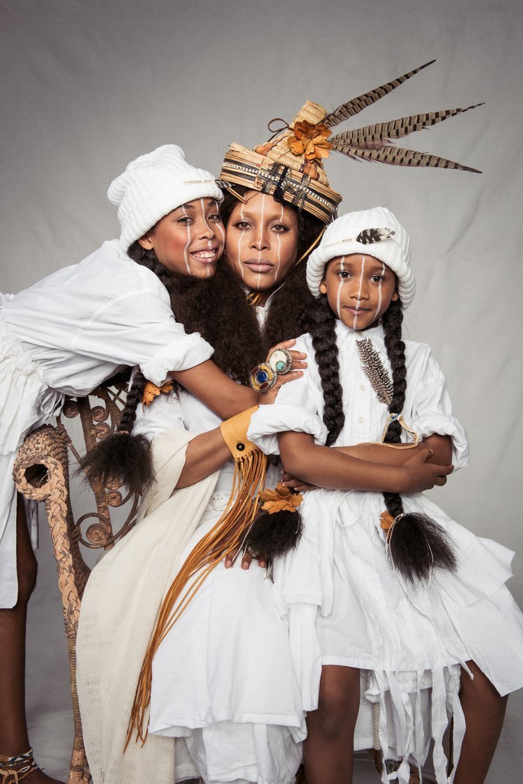 A mother with her lovely children in traditional white outfits posing for the best family photographer in Portland.jpg