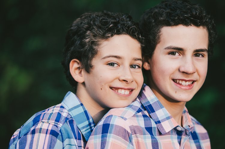 Two boys smiling and posing for a photo together, captured by a Portland, Oregon family photographer.jpg