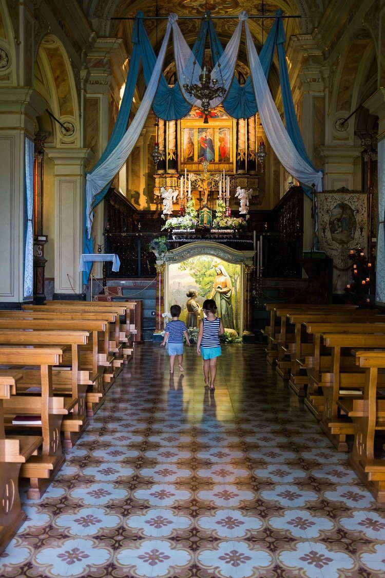 A travel photographer in Portland, Oregon captured two children walking in a church.jpg