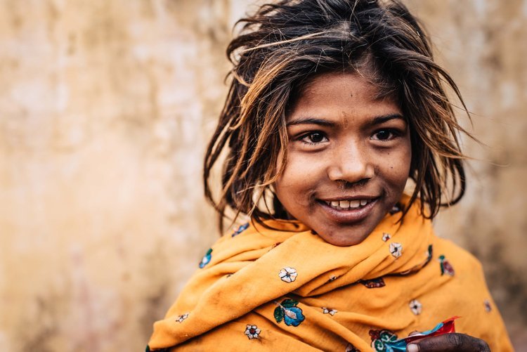 A young girl with long hair and a yellow scarf, captured by a travel photographer in Portland, Oregon.jpg