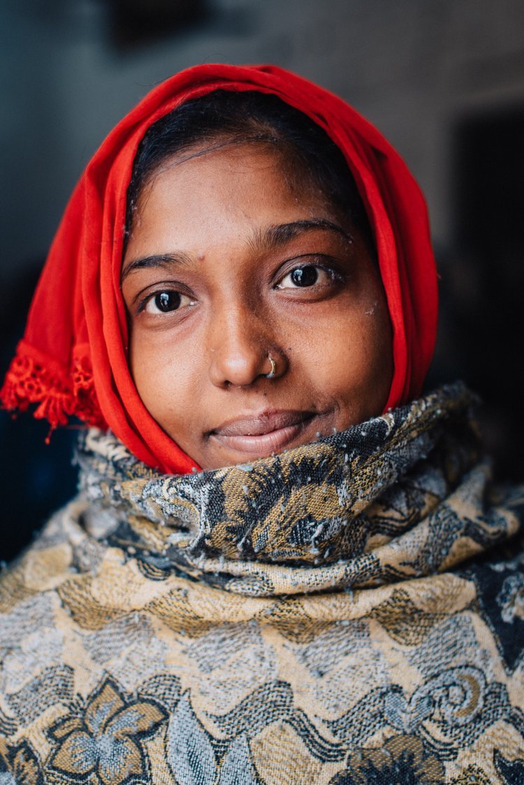 A woman wearing a red headscarf in India, captured by a professional travel photographer.jpg
