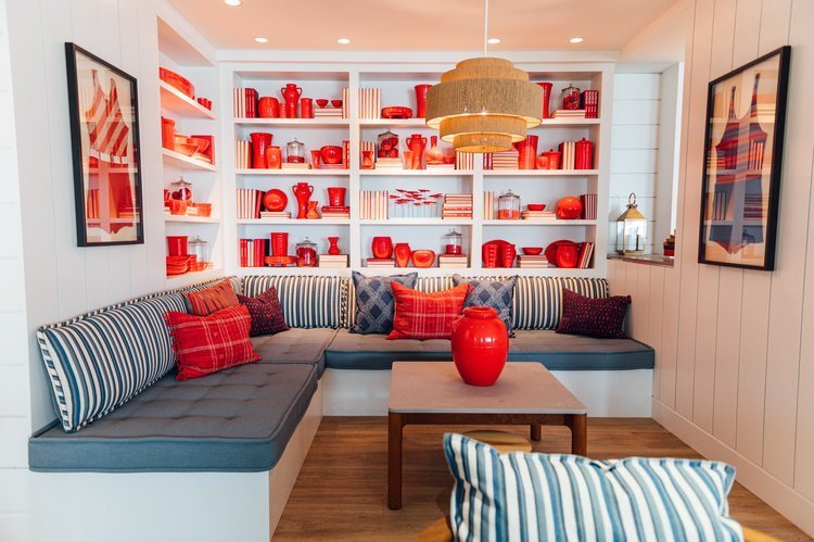 A room with red and white accents and a couch, captured by a top interior photographer.jpg