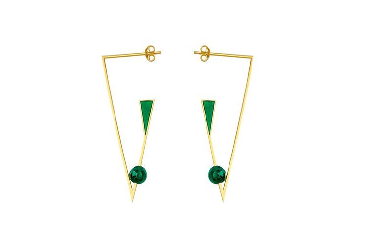 The image displays a pair of gold earrings embellished with beautiful green stones, captured by a portland product photographer.jpg