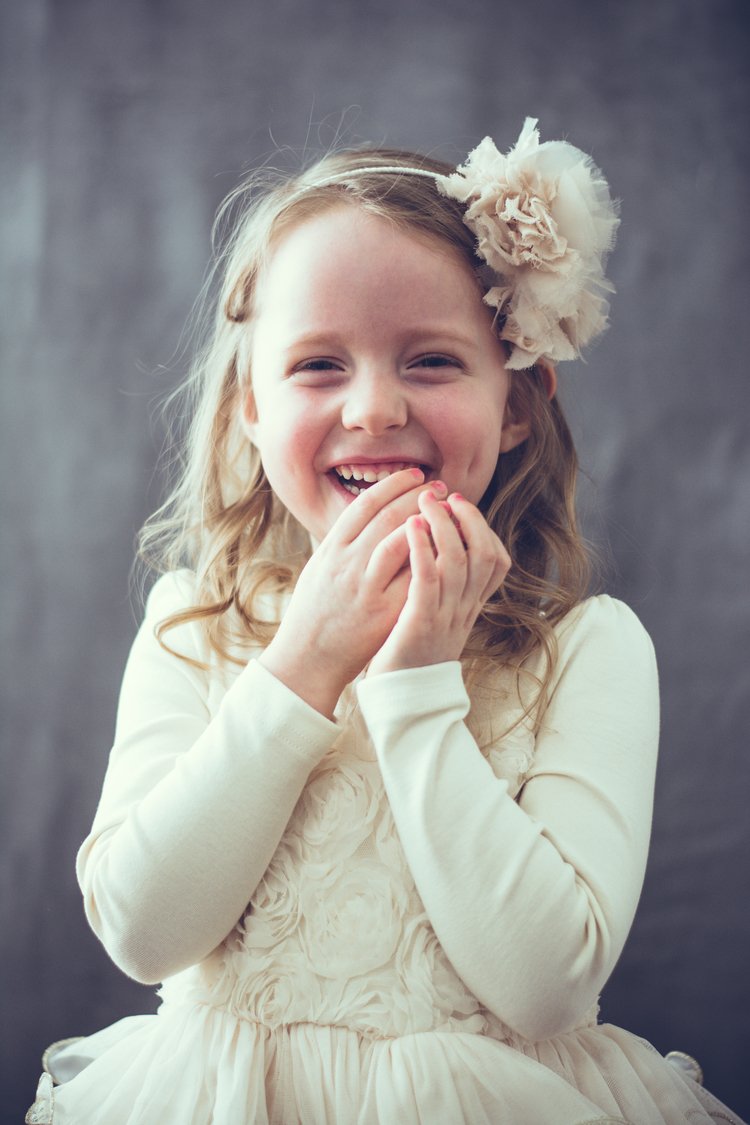 An adorable child, radiating happiness, photographed during a children  photography session.jpg