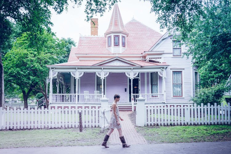 A person strolling in front of a house, photographed by Portland lifestyle photographers.jpg