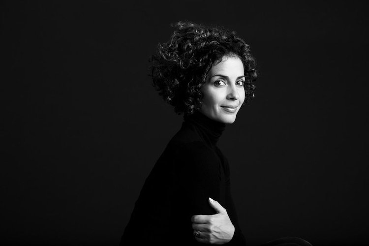 A black and white portrait of a woman taken by a Portland headshot photographer, showcasing her curly hair.jpeg
