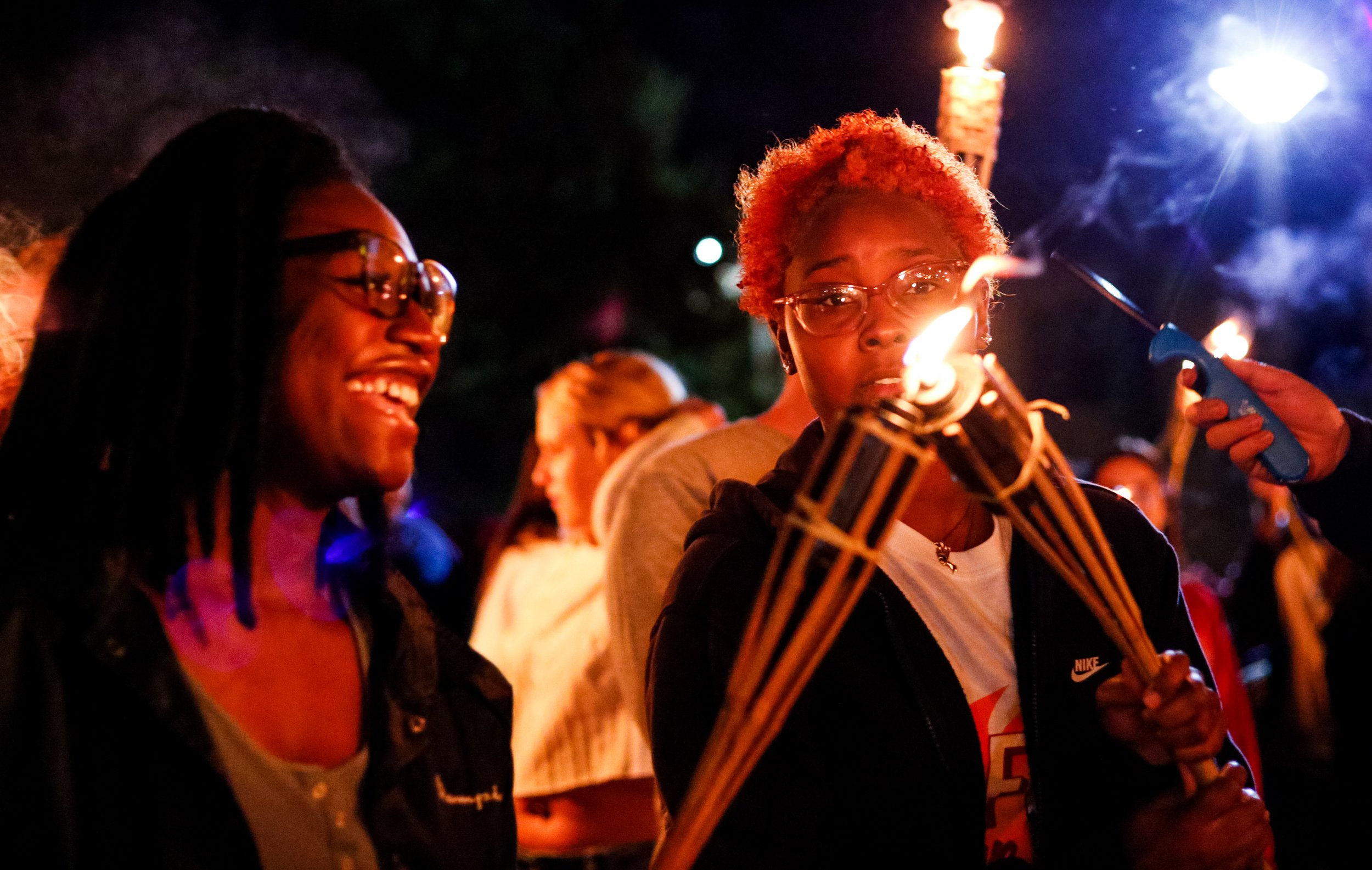 students-share-torch-fire.jpg