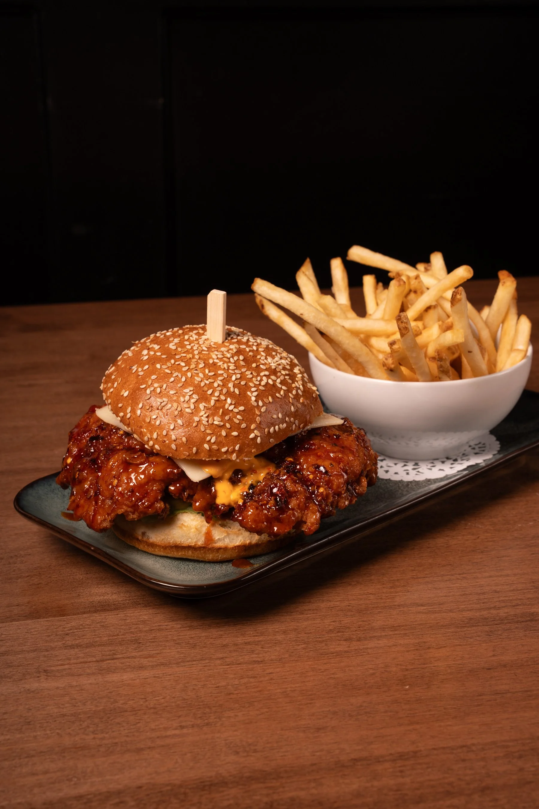 Burger and fries at Brix + Barrel!  Calgary, Alberta.  Let us host you. 