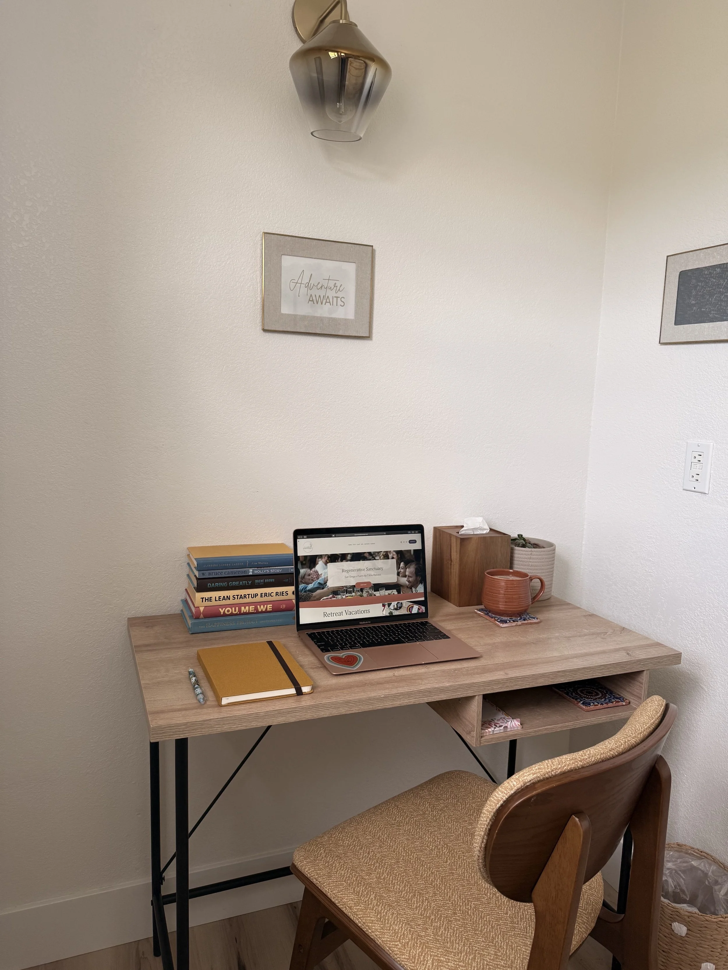 desk with laptop, notebook, latte setup